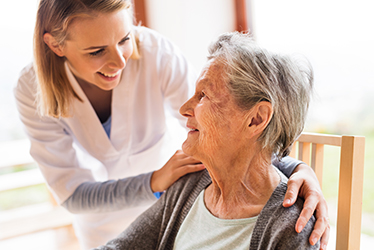 Nurse with an elderly patient