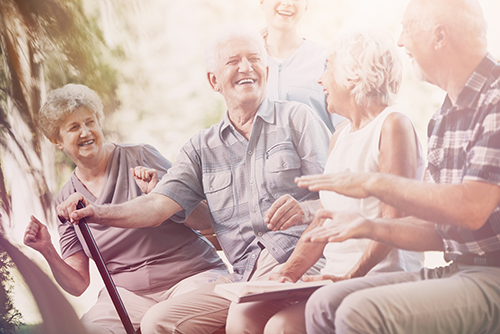 Group of elderly folk enjoying themselves outside